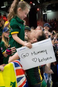 Emilea congratulated by daughter in crowd after rowing event