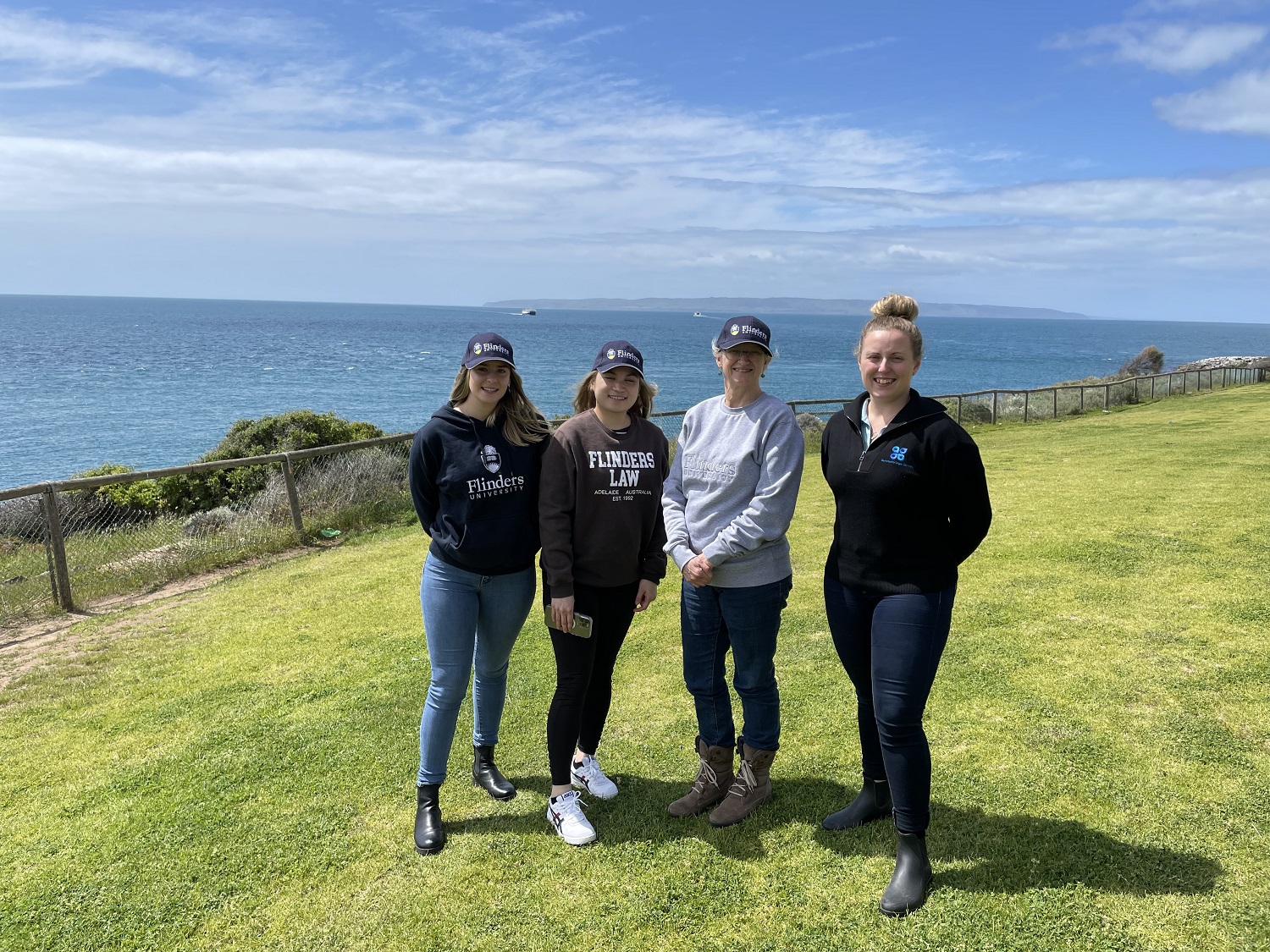 Flinders students and the Director of the Flinders Legal Centre visited Kangaroo Island to assist Community Legal Centres South Australia. Here they are with the CLCSA's Holly McCoy.